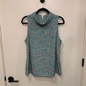Olivia Moon blue sleeveless blouse with multi dot pattern, size L.